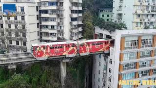 Chinese train that goes THROUGH a block of flats  Chongqing Mountain City  China News [upl. by Nnylear]