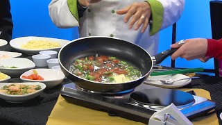 Olive Garden demonstrates how to make shrimp scampi [upl. by Anawik151]