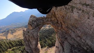 Wingsuit Pilot Flies Through Hole In Rock [upl. by Siouxie]