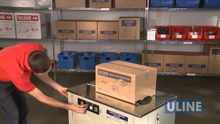 Uline H2079 SemiAutomatic Poly Strapping Machine  Demonstration [upl. by Reede794]