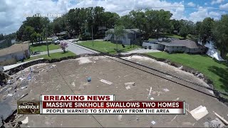 Massive sinkhole swallows two homes [upl. by Alejoa208]